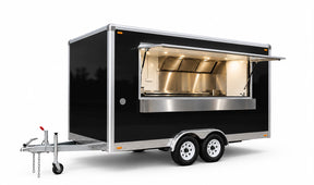 Three-quarter view of a 4m matte black commercial food trailer with open window and tandem axle chassis