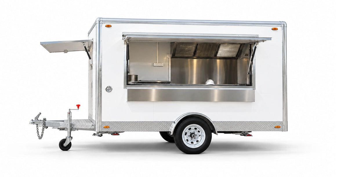 Compact 3-metre commercial kitchen trailer with integrated stainless steel exhaust canopy and prep benches